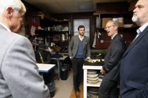 Davis, middle, gives tour of Aspetto's back shop.