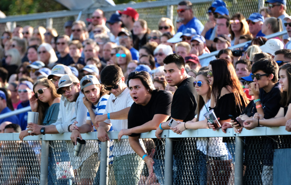 Students show their school pride by cheering on UMW’s Eagle Athletics at a soccer game.