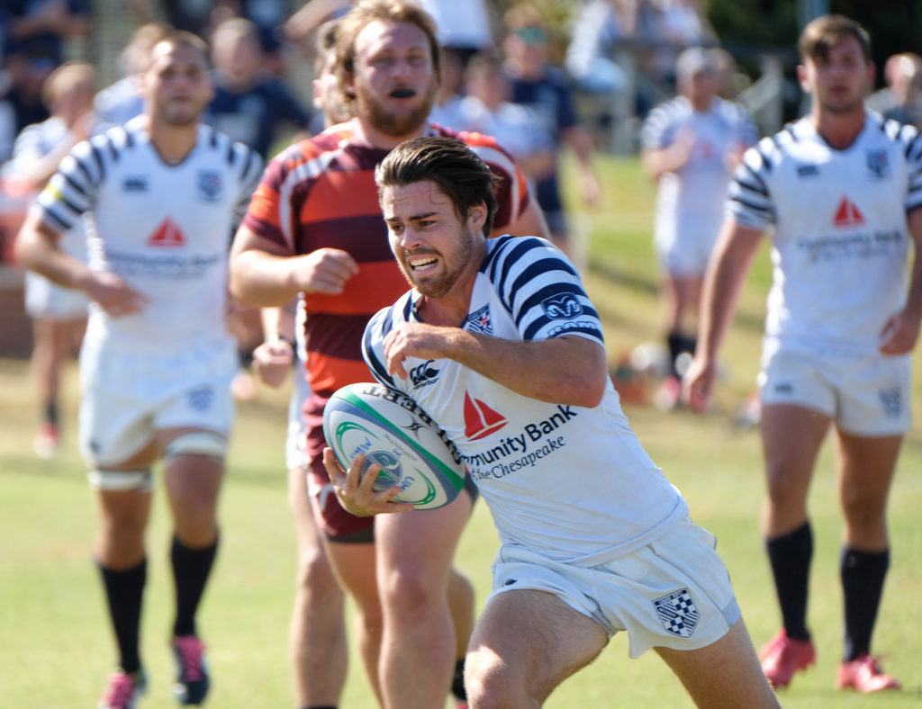 Men’s rugby – national championship competitors – runs the ball during a Homecoming match.