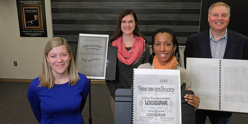 From left to right, junior Elyse Ridder, seniors Juliette Guillox and Bethel Mahoney, and UMW Philharmonic Director Kevin Bartram have been working on the Unearthing America’s Musical Treasures project. The UMW Philharmonic Orchestra will feature selections from the project during its March 17 concert. Photo by Norm Shafer.