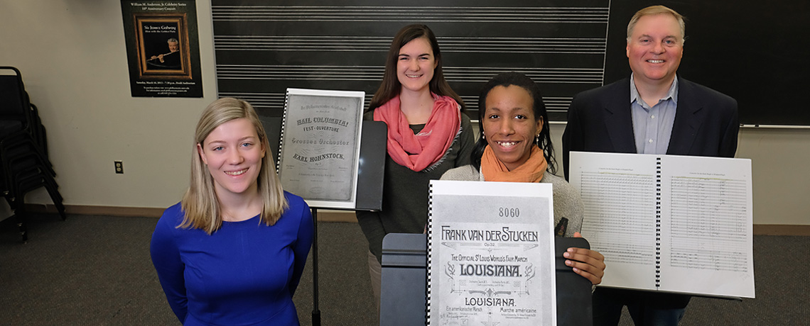 From left to right, junior Elyse Ridder, seniors Juliette Guillox and Bethel Mahoney, and UMW Philharmonic Director Kevin Bartram have been working on the Unearthing America’s Musical Treasures project. The UMW Philharmonic Orchestra will feature selections from the project during its March 17 concert. Photo by Norm Shafer.