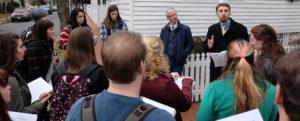 Michael Spencer, top right, talks with historic preservation majors outside the Mary Washington House.