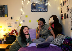 UMW freshmen Jenifer Ballon and Destiny Jordan, in their Marshall Hall room, are part of a TV feature set to air tonight on WUSA9 News at 11. Photo by Norm Shafer.