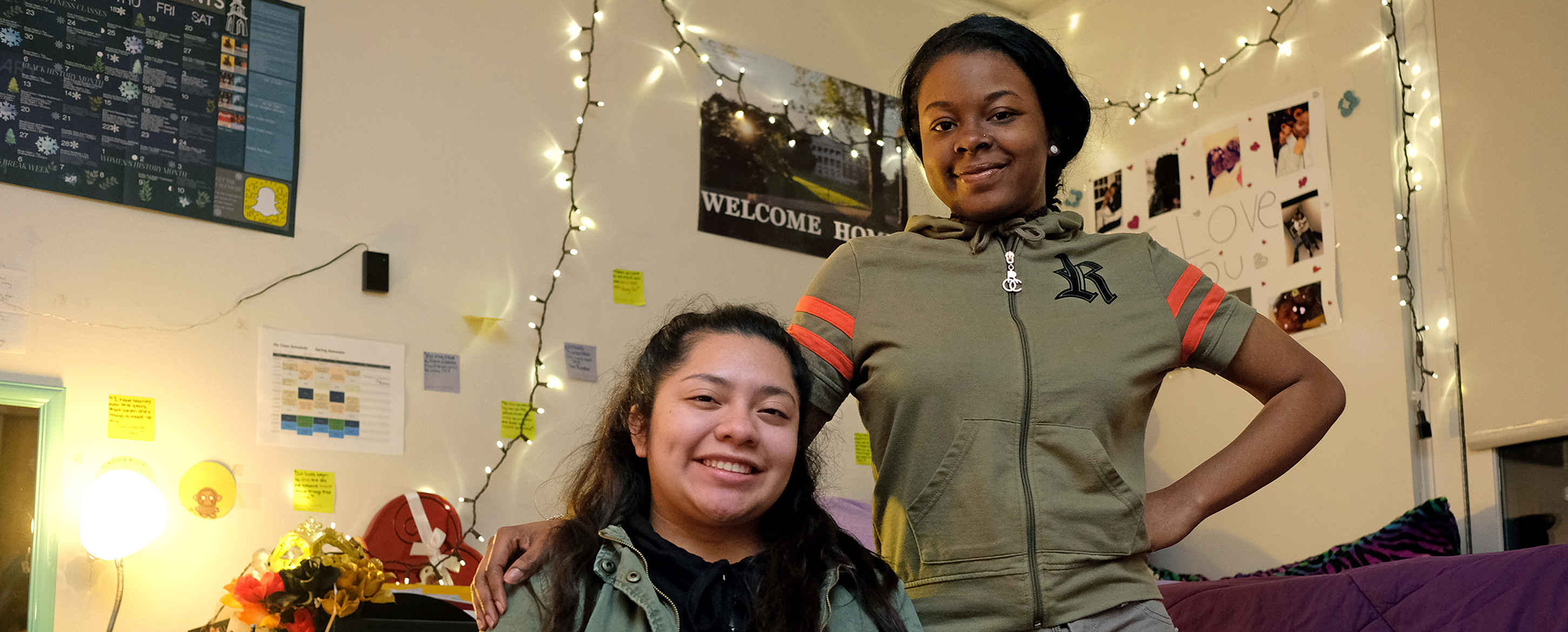 UMW freshmen Jenifer Bailon (left) and Destiny Jordan, in their Marshall Hall room, are part of a TV feature set to air tonight on WUSA9 News at 11. Photo by Norm Shafer.