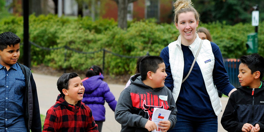 UMW Mortar Board president Madalyn Rymer leads Fredericksburg ESL students on a campus visit April 17. (Suzanne Rossi)