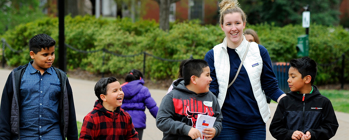 UMW Mortar Board president Madalyn Rymer leads Fredericksburg ESL students on a campus visit April 17. (Suzanne Rossi)