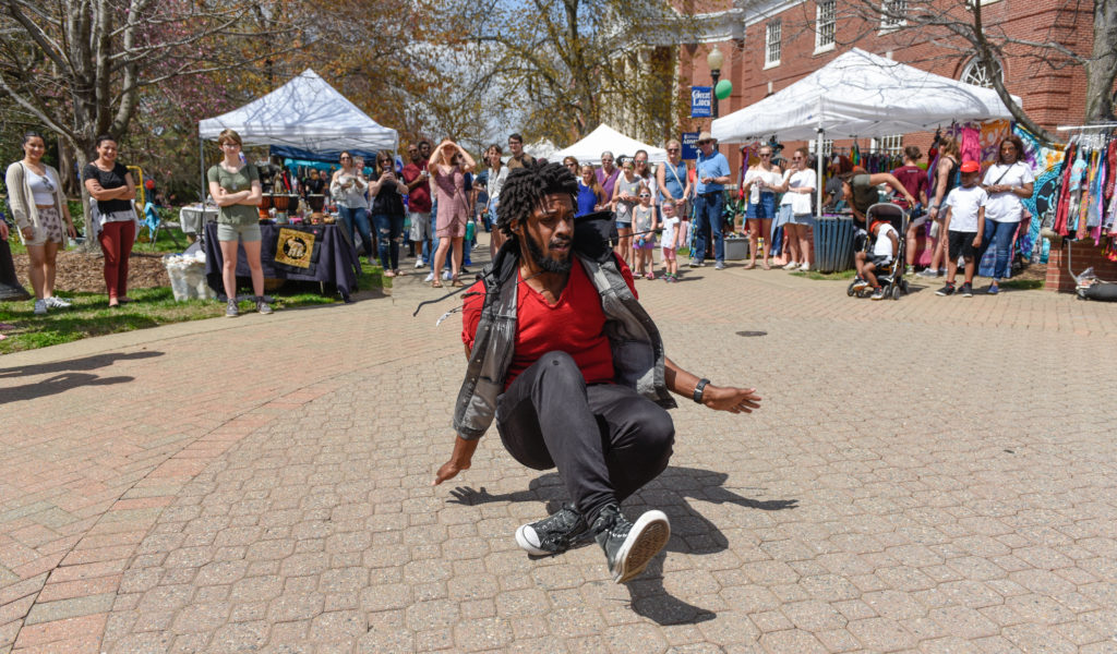 UMW education grad student Michael Middleton performs an impromptu dance at the  Multicultural Fair. Phot by Clem Britt.