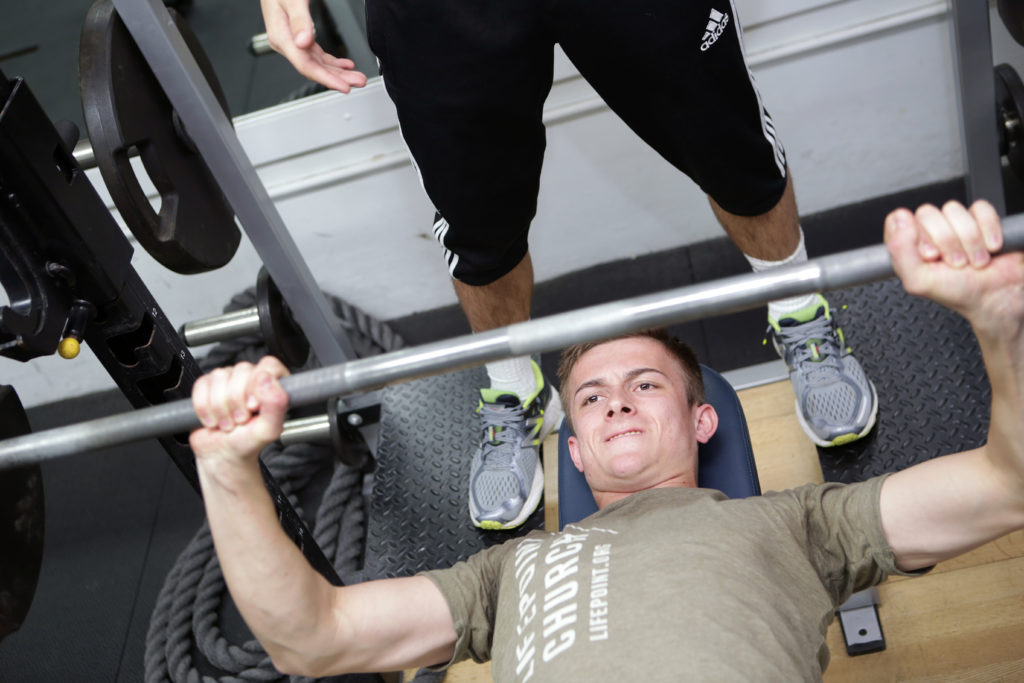 Freshman Joshua Everard lifts weights during a men’s soccer strength and conditioning practice.