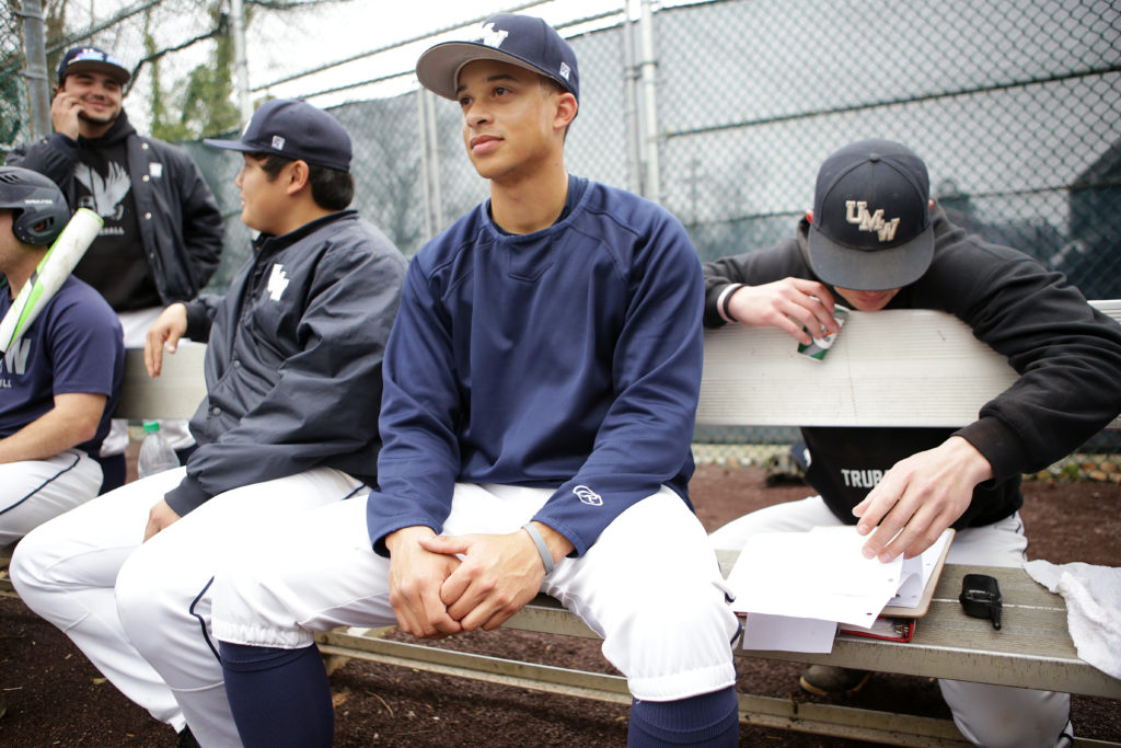 Sophomore Zavier Webb watches his teammates warm up in the batting cages.