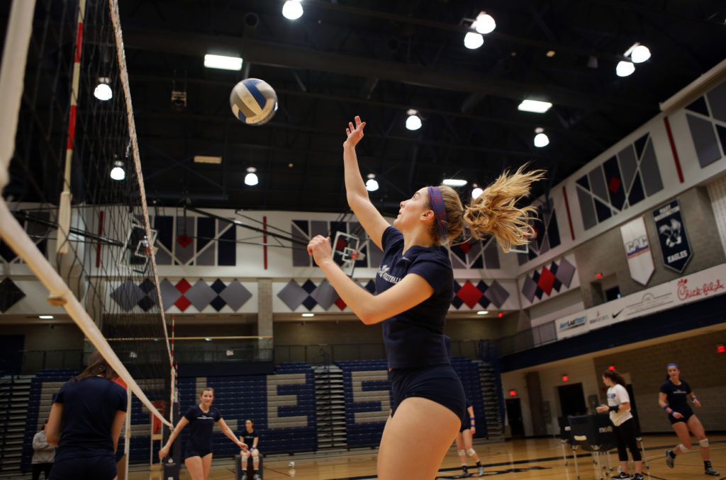 Sophomore Skyler Sisk jumps for the ball during a volleyball drill in the Anderson Center’s Ron Rosner Arena.