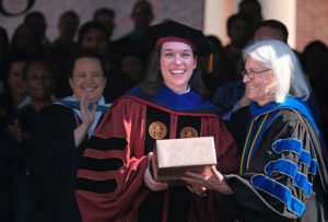 Catie Finlayson is congratulated by Provost Mikhalvesky.