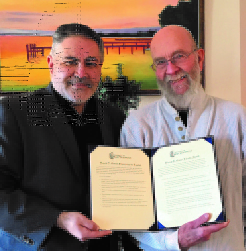 Dr. Gary Richards (left) presents Dr. Donald Glover with two resolutions.
