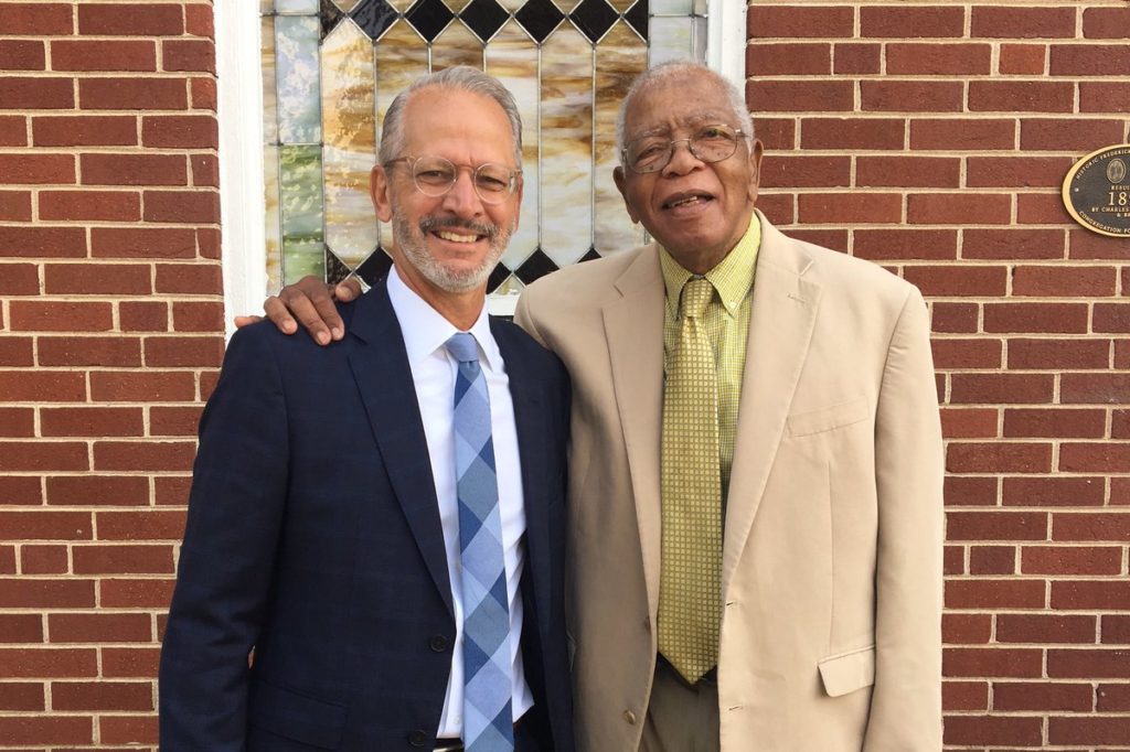 UMW President Troy Paino stands with Fredericksburg artist Johnny Johnson, who in 1968 became the university's first African-American faculty member. (Erika Bush)