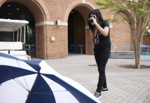 Marissa Juarez, who teaches English at Central New Mexico Community College, uses a camera to complete an assignment during DPL's Digital Storytelling session. Photo by Dave Ellis.