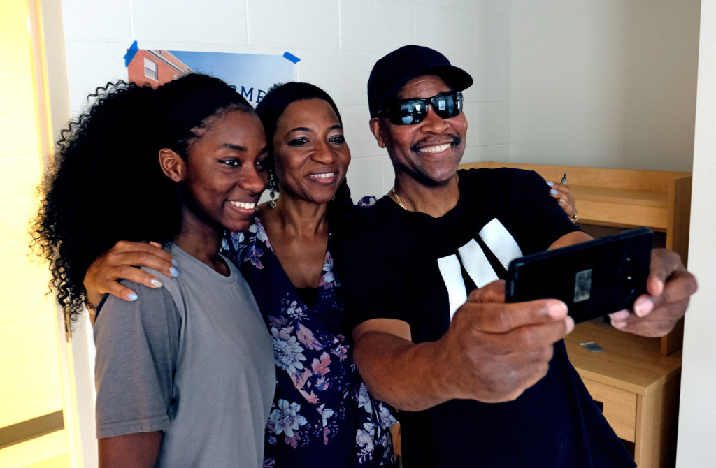 Valerie Ebenki, her mom Elenour and family freiend John take a souvenir selfie in her dorm room during move-in day at UMW. (Photo by Norm Shafer).