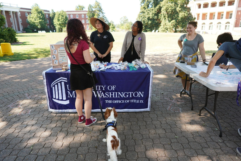 UMW students stop to chat on Campus Walk during the "consent campaign," held earlier this month. Photo by Suzanne Rossi.
