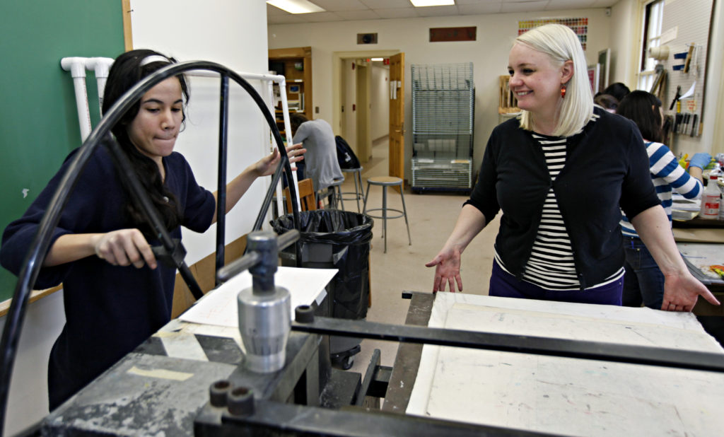 Associate Professor of Studio Art Rosemary Jesionowski, pictured here working with students during a printmaking class, is spending three months documenting the country using a historic photographic process called albumen printing.