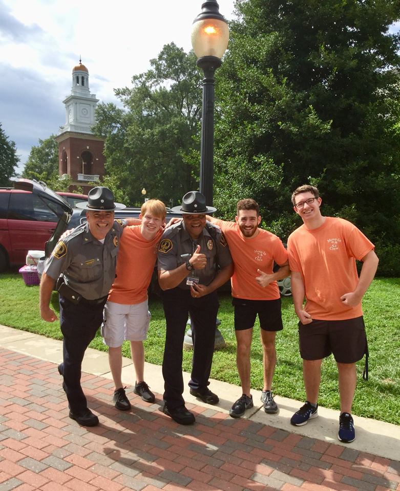 UMW Police Chief Mike Hall, with students on Move-In Day, made accreditation his mission. 
