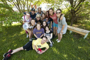 UMW Professor of Art Carole Garmon (fourth from left) leans on her former student, Sarah Perry, after Garmon's Environmental Art class completed a project at Downtown Greens. Photo by Karen Pearlman.