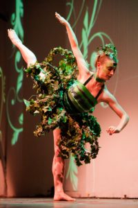 Perry, shown here at a wearable art fashion show in Toulouse, France, made this dress from living greenery.