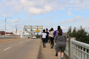 UMW students begin the emotional trek arcoss the Edmund Pettus Bridge, site of the brutal 1965 Bloody Sunday police attack against civil rights protestors.