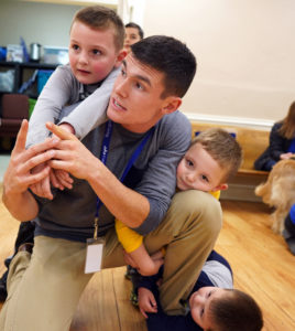 Crickman enjoys a light moment with Levi, Hunter and Carter Fishback.