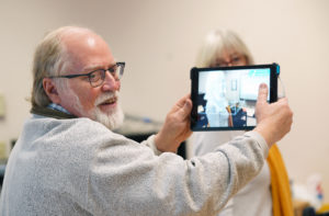 University of Mary Washington Professor of Education George Meadows demonstrates 3-D printing to a group of furloughted federal workers.