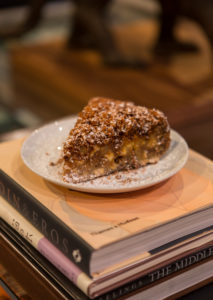 Cast members use a Julia Child recipe to create clafoutis, a French flan-like dish, to be eaten onstage during God of Carnage, which runs Feb. 14 to 24 in Klein Theatre. Photo by Geoff Green.