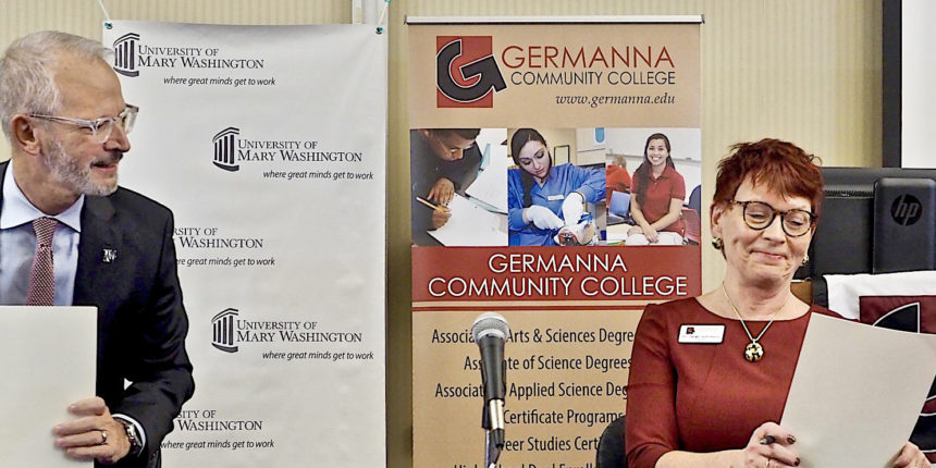 President Troy Paino (left), and Germanna Community College President Janet Gullickson sign the enhanced transfer agreement (Photo by Robert A. Martin)