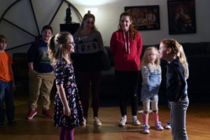 Theatre majors Diana Bloom (in red) and Victoria Fortune lead a recent community theater workshop. Photo by Suzanne Rossi.