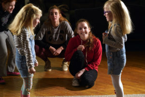 Fortune and Bloom watch while twin sisters try out some of their new acting skills at a recent Stage Door Youth Workshop. Photo by Suzanne Rossi.