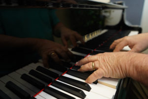 Doug Gately plays one of the new Kawai pianos, which will replace UMW's older instruments. Photo by Suzanne Carr Rossi.