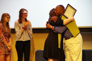 Erin Shaw hugs Cedric Rucker, associate vice president and dean of Student Life, at the Eagle Awards ceremony. Shaw won the Grace Mann Launch Award on Thursday night. Photo by Noah Stroble.