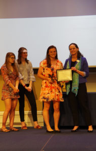 Graduating senior Paige Hildebrand won the Prince Woodard Outstanding Leader Award, presented by Juliette Landphair, vice president of Student Affairs. Photo by Noah Stroble.