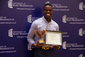 Nehemia Abel accepted the Outstanding Large Scale Program Award for Charity Match - UMW Men's and Women's Club Soccer at the Eagle Awards on Thursday Night. Photo by Noah Stroble.