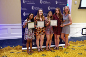 (From L-R): Anika Hussain, Jordan Chandler, Elisabeth DellaRova, Allison Grant and Carleigh Rahn accepted the Outstanding Community Service Organization Award on behalf of COAR. Hussain also won the Clara Boyd Wheeler Award and Jordan Chandler won the Elizabeth A. Baumgarten Leadership Award. Photo by Noah Stroble.