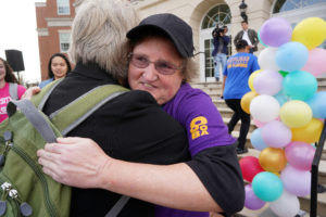 Braxton shares a hug from one of her fans in front of the University Center.