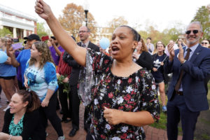 Braxton's supervisor Kiesha Childs cheers Grace Anne Braxton along with President Paino and an onslaught of campus well-wishers.