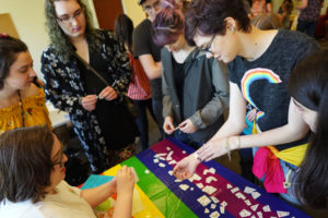 Grace Green (right) of UMW gets a temporary tattoo at the 29th Annual Multicultural Fair at UMW on Saturday. Photo by Suzanne Carr Rossi.