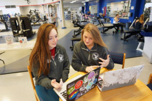UMW senior Laura Lang (left) works with her supervisor, graduate assistant Alex Bergner, at the Fitness Center. Bergner worked three years with Lang before learning of the high school accident that robbed her memory. Photos by Suzanne Carr Rossi.
