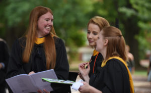 Casey English from Mechanicville Va,, Alexandra Smith from Burke VA and Megan Turner from Williamsburg VA. (left to right) before the start of the UMW Graduate School graduation ceremony. All three received Master of Science in Education degrees.