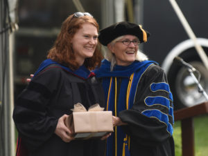 Elizabeth-Johnson-Young, recipient of the Alumni Association Outstanding Young Faculty Member Award, poses with Provost Mikhalevsky