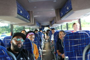 In her role as a student leader, Mehari worked closely with the James Farmer Multicultural Center to make the fall break trip to Selma, Alabama, possible. Mehari is seen here on the bus with James Farmer Multicultural Center director Marion Sanford to her right and assistant director Chris Williams to her left.