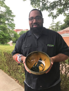 Kendrick Keener with a ceramic bowl he made. Most of his own work is in printmaking, but he also loves ceramics and painting, and he dabbles in a bit of everything. Photo courtesy of the artist.