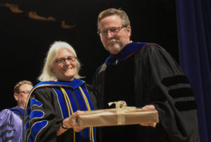 Wood Richardson, recipient of the Graduate Faculty Award, poses with Provost Mikhalevsky. 