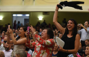 Friends and family cheer on the graduate candidates in Dodd Auditorium.