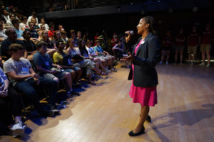 Associate Dean of Student Involvement Melissa Jones speaks to members of the incoming class during Orientation last year. The annual event, taking place on campus this month, is filled with team-building experiences designed to get students acquainted with the UMW community. Photo by Suzanne Carr Rossi.