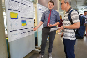 UMW student John Wood explains the poster that represents the research he did during the 10-week Summer Science Institute. Wood's project is entitled "Observing Wave Packet Dynamics in Small Diatomic Molecules." Photos by Suzanne Carr Rossi.