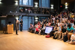 DPL is packed full of dynamic speakers and powerful collaborative experiences. Here, attendees listen to Ruha Benjamin, a Princeton University professor who applies a critical lens to issues of race and technology. Photo by Matthew Binamira Sanders. 