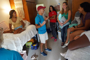 President Paino and wife Kelly joined in the fun, helping students unpack and get their rooms set up. Photo by Suzanne Rossi.